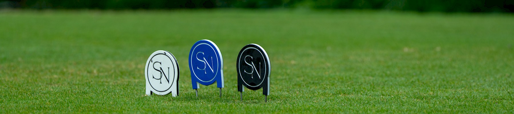 Colorful golf tee markers with 