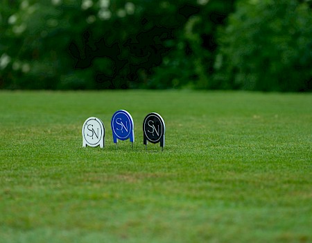 Colorful golf tee markers with 