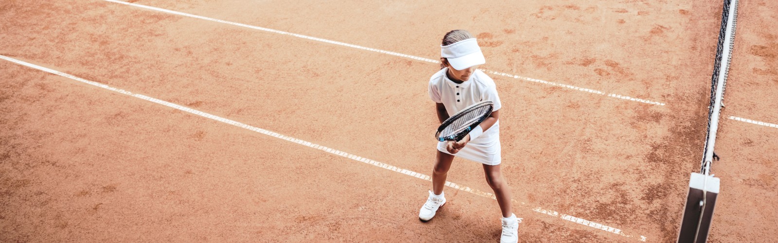 Junior girl playing tennis
