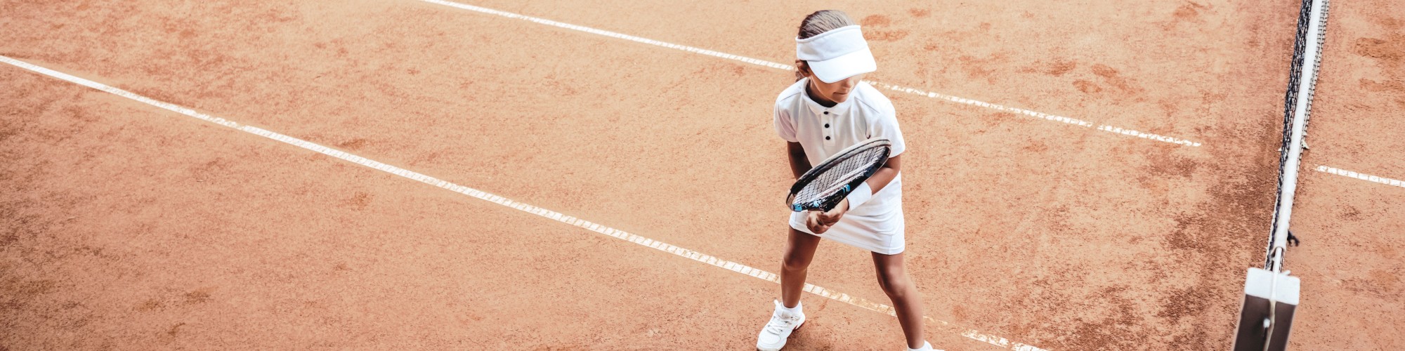Junior girl playing tennis