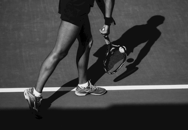 Black and white tennis serve